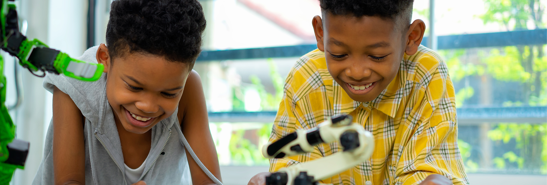 Little girl looking into a microscope