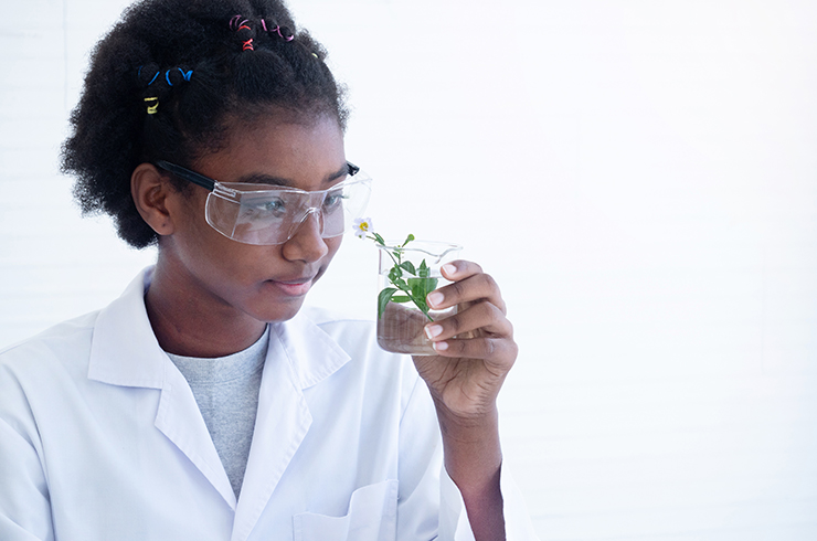 Kid looking closely at a snail
