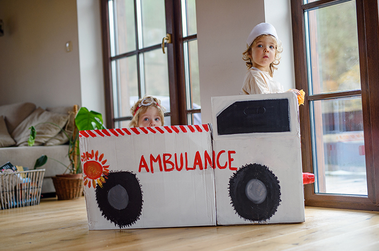 Two kids playing at being healthcare workers